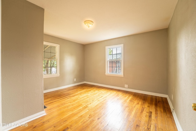 714 E Emerald Ave, Knoxville, TN 37917 - unfurnished room featuring hardwood / wood-style floors, baseboards, and a textured wall
