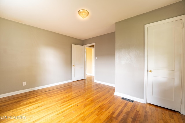 714 E Emerald Ave, Knoxville, TN 37917 - unfurnished bedroom featuring baseboards and light wood finished floors