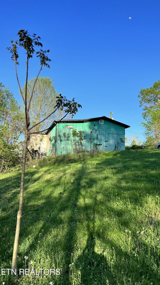 647 S Sudenny Ln, Lafollette, TN 37766 - view of home's exterior featuring a yard and an outbuilding