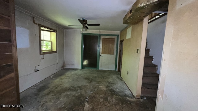 647 S Sudenny Ln, Lafollette, TN 37766 - empty room featuring concrete floors, stairs, and ceiling fan