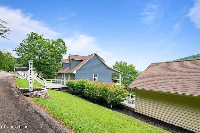 148 Mariner Point Rd, Lafollette, TN 37766 - view of side of home featuring a yard and a shingled roof
