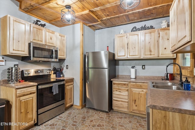 kitchen with appliances with stainless steel finishes, wooden ceiling, a sink, light brown cabinets, and light stone finish flooring