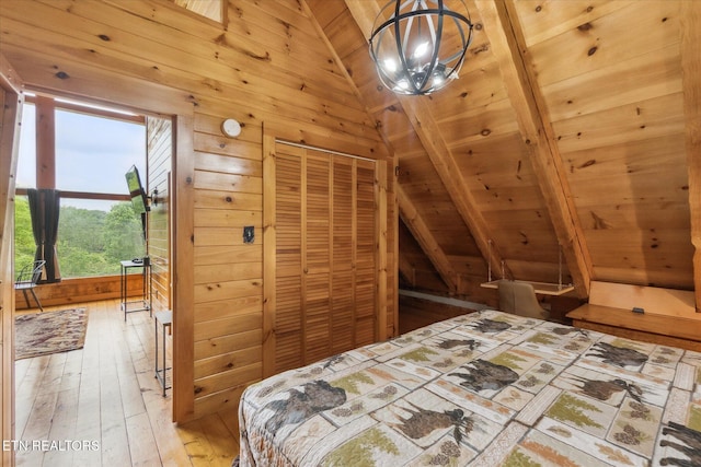unfurnished bedroom featuring vaulted ceiling, wood ceiling, hardwood / wood-style floors, and wood walls