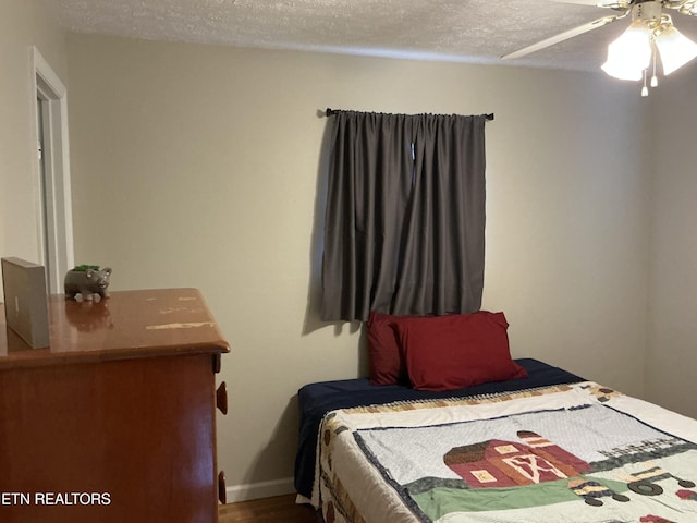 166 Stratford Rd, Harrogate, TN 37752 - bedroom featuring a textured ceiling, wood finished floors, and ceiling fan