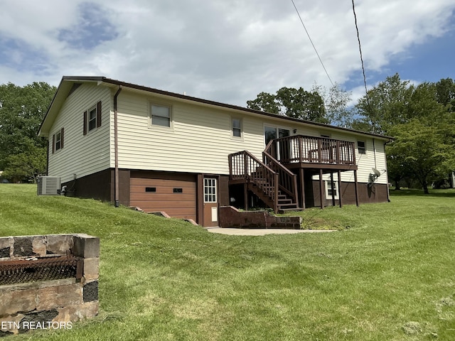 166 Stratford Rd, Harrogate, TN 37752 - rear view of house with a garage, stairs, a wooden deck, central AC unit, and a lawn