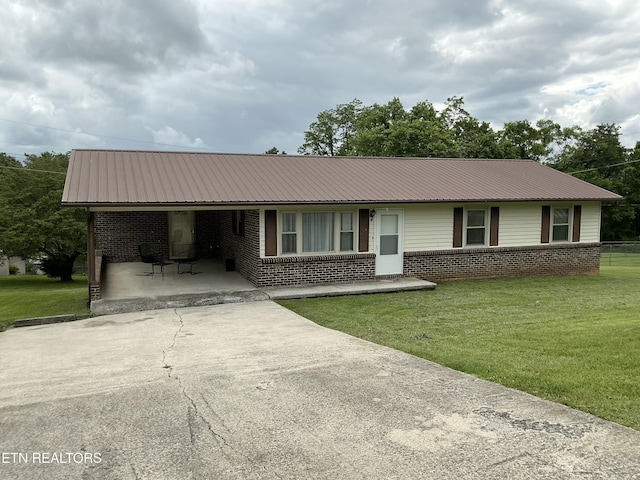 166 Stratford Rd, Harrogate, TN 37752 - ranch-style home featuring brick siding, metal roof, and a front lawn