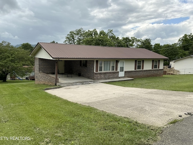 166 Stratford Rd, Harrogate, TN 37752 - single story home featuring brick siding, metal roof, and a front lawn