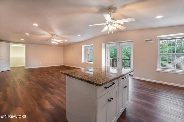 409 Turner Rd, Crossville, TN 38555 - kitchen featuring a ceiling fan, vaulted ceiling, dark wood finished floors, baseboards, and a center island