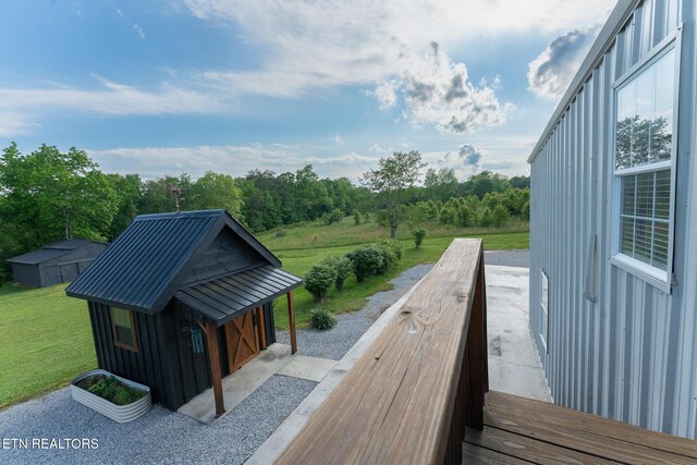 409 Turner Rd, Crossville, TN 38555 - deck featuring a yard, an outbuilding, and a storage shed
