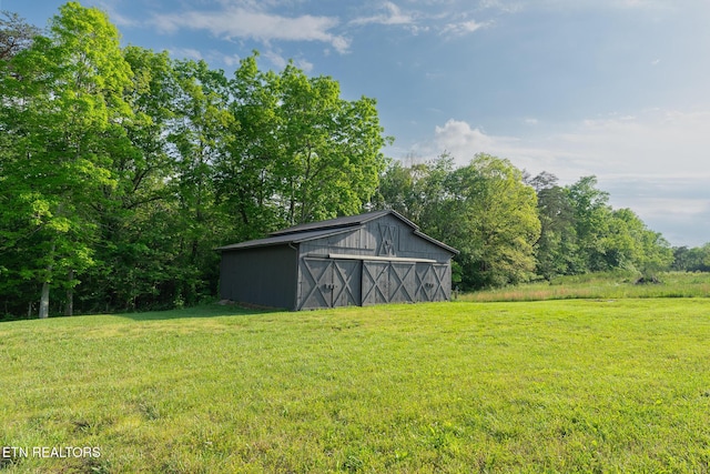 409 Turner Rd, Crossville, TN 38555 - view of green lawn featuring a barn and an outbuilding
