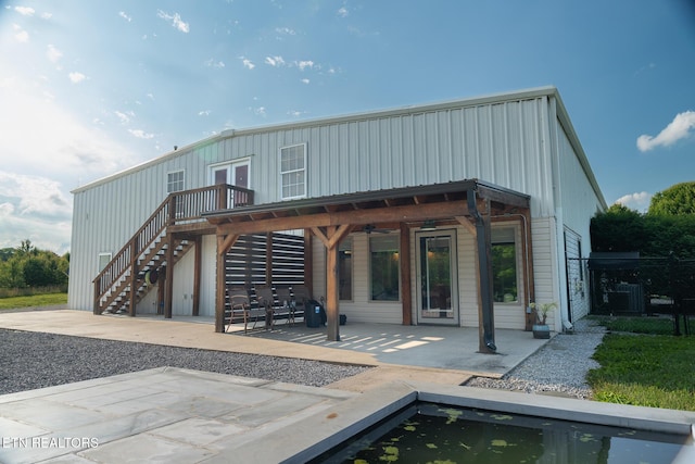 409 Turner Rd, Crossville, TN 38555 - back of house featuring a patio, stairs, a ceiling fan, fence, and board and batten siding