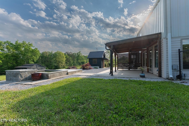 409 Turner Rd, Crossville, TN 38555 - view of grassy yard featuring a patio, an outdoor structure, and a shed