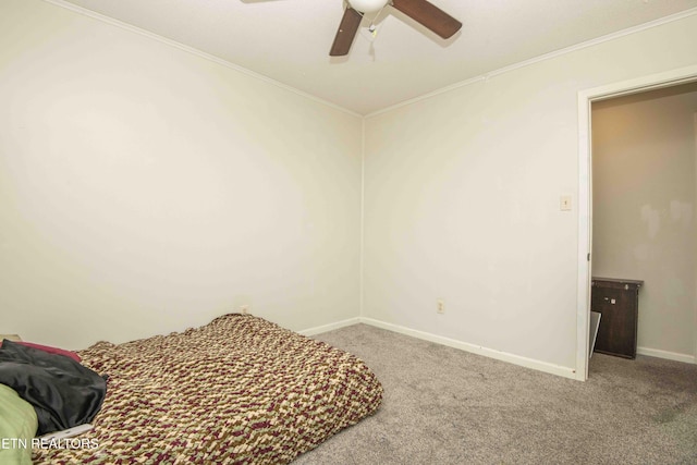bedroom featuring carpet flooring, ornamental molding, baseboards, and ceiling fan