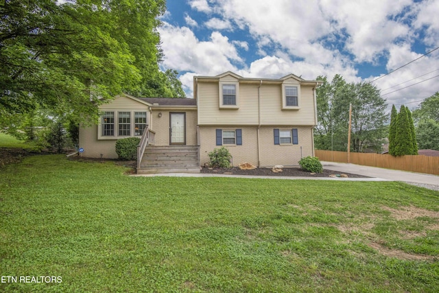 split level home with brick siding
