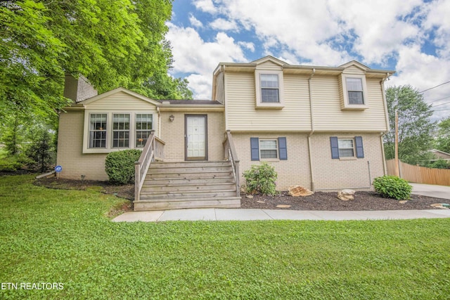 tri-level home with brick siding