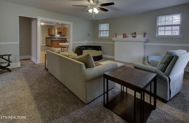 129 S Elmwood St, Knoxville, TN 37914 - living area with a ceiling fan, light colored carpet, baseboards, and a fireplace