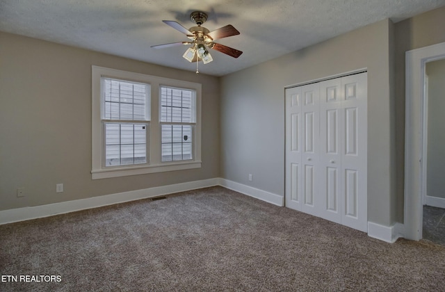 129 S Elmwood St, Knoxville, TN 37914 - unfurnished bedroom with carpet flooring, a closet, baseboards, ceiling fan, and a textured ceiling