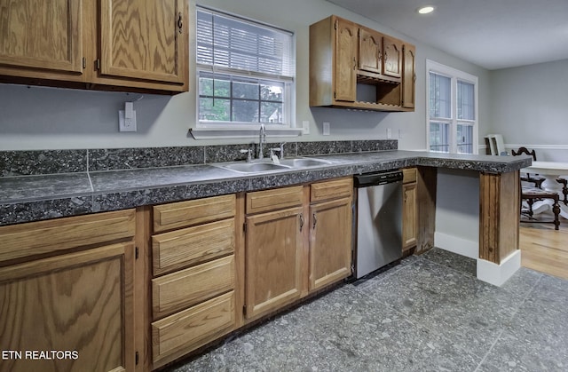 129 S Elmwood St, Knoxville, TN 37914 - kitchen featuring stainless steel dishwasher, a sink, recessed lighting, brown cabinets, and a peninsula
