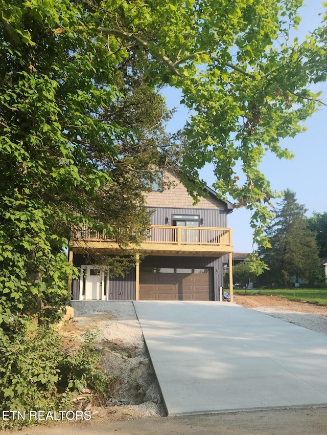 707 Powell Valley Shores Cir, Speedwell, TN 37870 - view of front of property with concrete driveway, a garage, and a deck