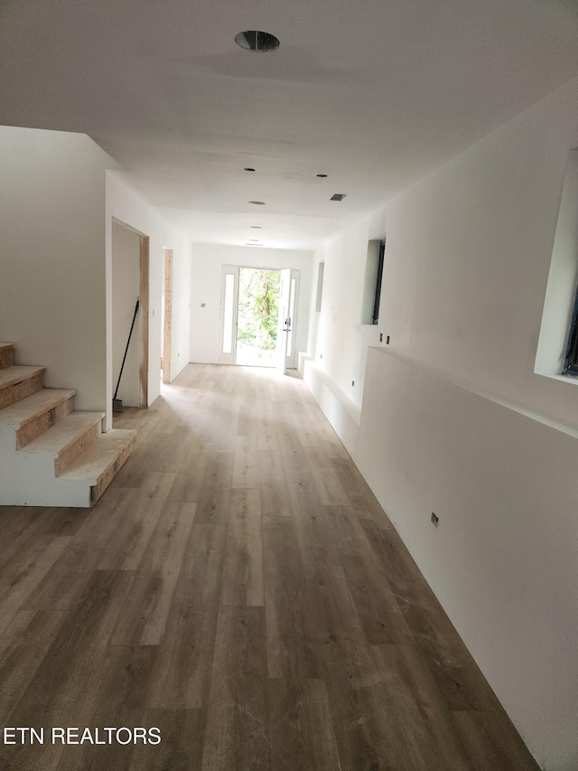 707 Powell Valley Shores Cir, Speedwell, TN 37870 - hallway with wood finished floors and stairway