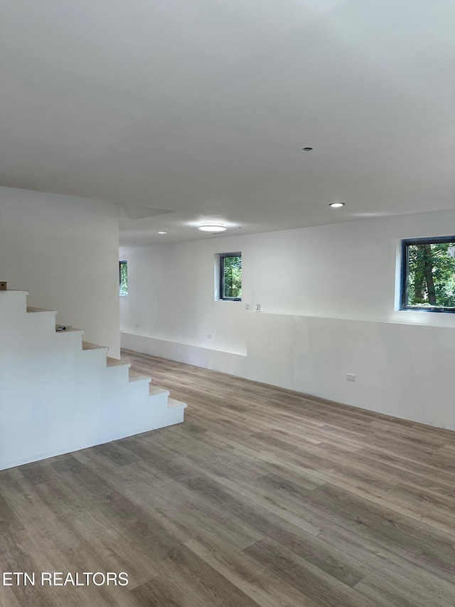 707 Powell Valley Shores Cir, Speedwell, TN 37870 - basement featuring wood finished floors, stairway, and recessed lighting