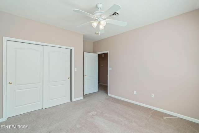 3241 Mountain Spring Way, Knoxville, TN 37917 - unfurnished bedroom featuring light carpet, baseboards, a closet, and a ceiling fan