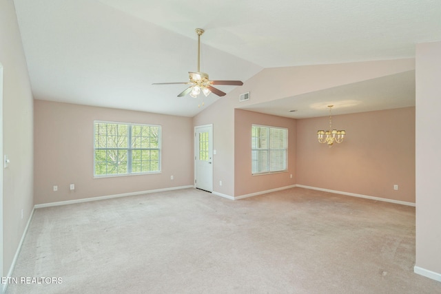 3241 Mountain Spring Way, Knoxville, TN 37917 - empty room with a chandelier, vaulted ceiling, a ceiling fan, light carpet, and baseboards