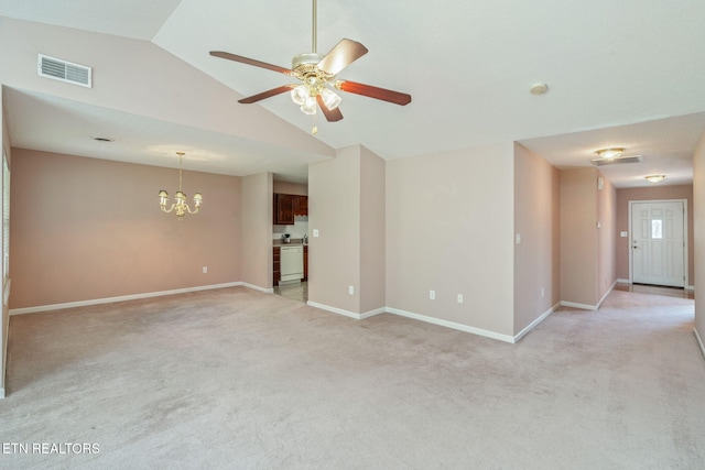 3241 Mountain Spring Way, Knoxville, TN 37917 - unfurnished living room with a chandelier, light colored carpet, lofted ceiling, baseboards, and a ceiling fan