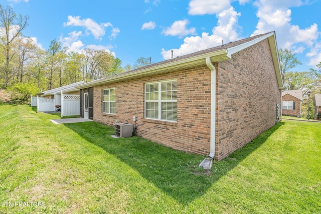 3241 Mountain Spring Way, Knoxville, TN 37917 - back of property with central air condition unit and brick siding