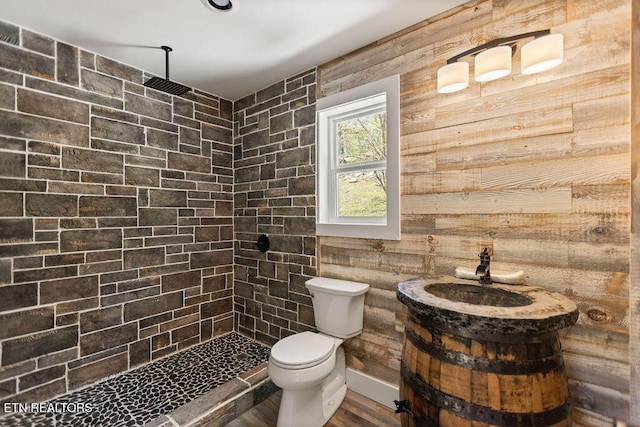 830 Hembree Hollow Rd, Townsend, TN 37882 - full bath with tiled shower, toilet, wood finished floors, vanity, and wooden walls