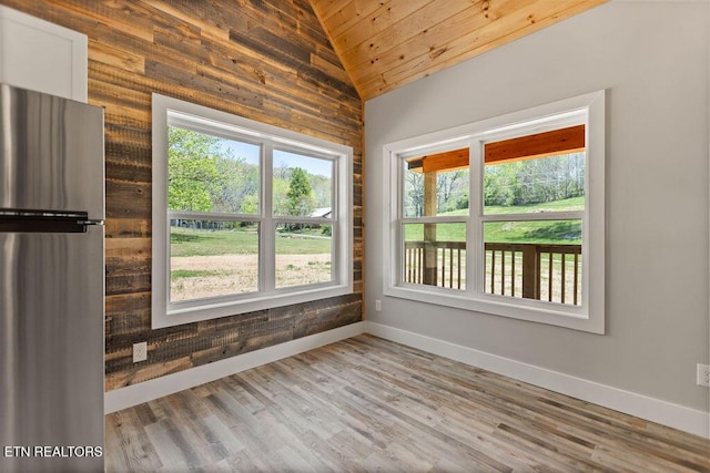 830 Hembree Hollow Rd, Townsend, TN 37882 - unfurnished room featuring lofted ceiling, healthy amount of natural light, baseboards, wooden ceiling, and wood finished floors