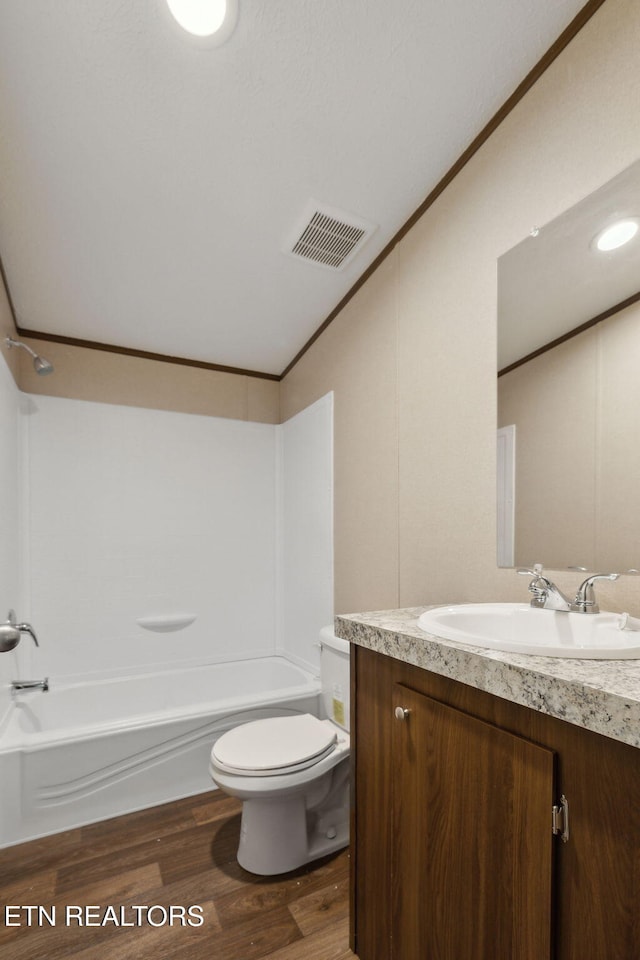 4001 Lilac Ave, Knoxville, TN 37914 - bathroom featuring vanity, toilet, wood finished floors, bathing tub / shower combination, and lofted ceiling