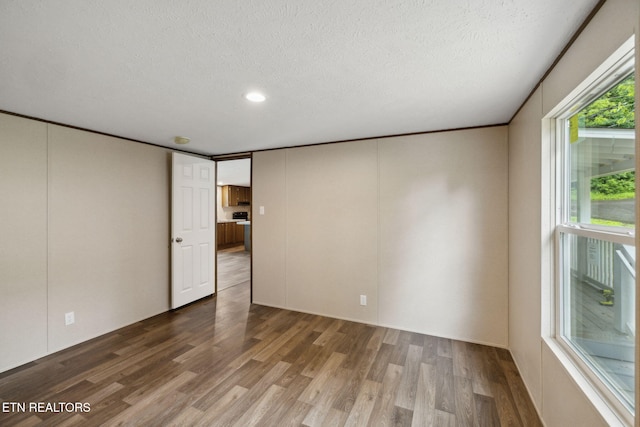 4001 Lilac Ave, Knoxville, TN 37914 - spare room featuring wood finished floors, a textured ceiling, and recessed lighting