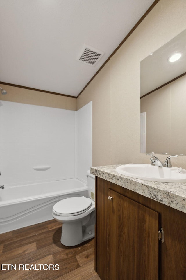 4001 Lilac Ave, Knoxville, TN 37914 - full bath featuring vanity, toilet, lofted ceiling, wood finished floors, and tub / shower combination