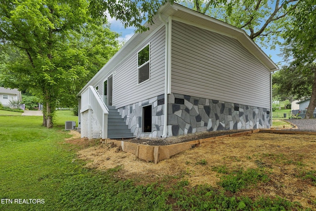 4001 Lilac Ave, Knoxville, TN 37914 - view of side of home featuring stairs, central AC, and a yard