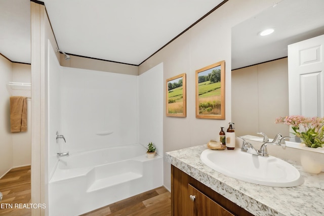 4001 Lilac Ave, Knoxville, TN 37914 - full bath featuring vanity, wood finished floors, and bathing tub / shower combination