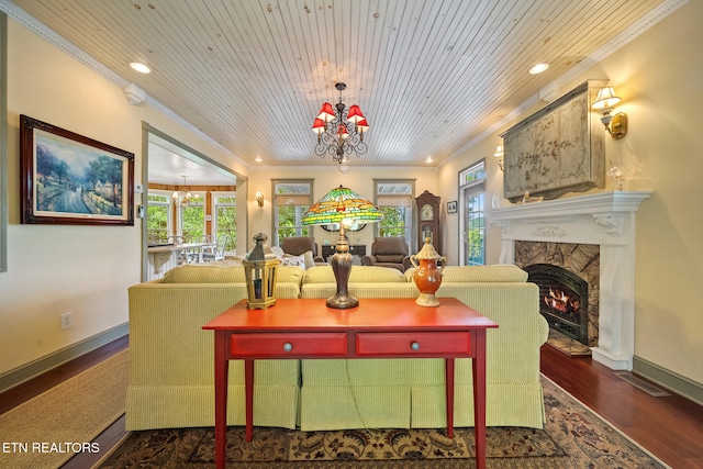 157 Wildcat Hollow Rd, New Tazewell, TN 37825 - living room with a chandelier, ornamental molding, recessed lighting, a warm lit fireplace, and wood finished floors