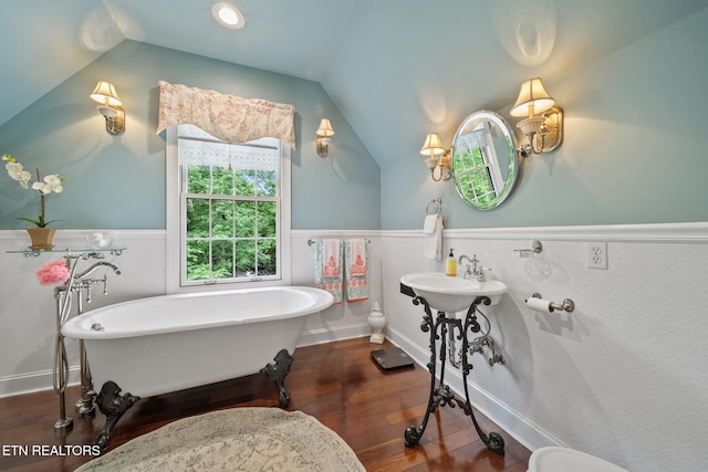 157 Wildcat Hollow Rd, New Tazewell, TN 37825 - bathroom featuring lofted ceiling, a wainscoted wall, a soaking tub, and wood finished floors
