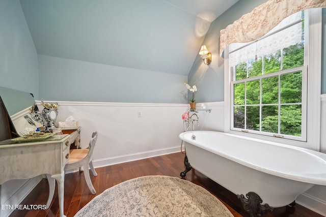 157 Wildcat Hollow Rd, New Tazewell, TN 37825 - bathroom featuring lofted ceiling, a freestanding bath, wainscoting, and wood finished floors