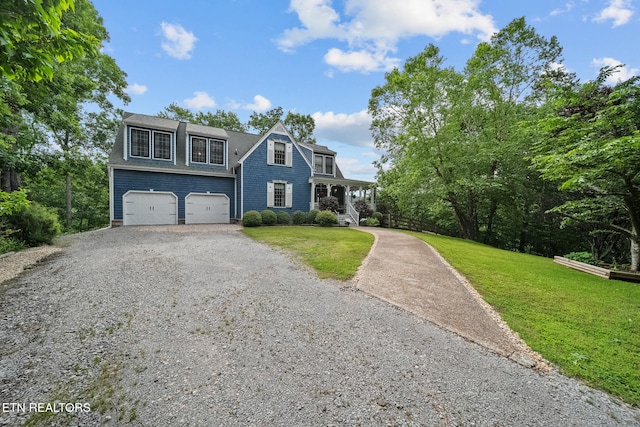 157 Wildcat Hollow Rd, New Tazewell, TN 37825 - shingle-style home featuring gravel driveway, a porch, a front lawn, and an attached garage