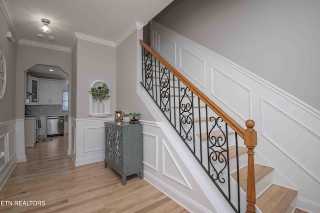 160 Brentwood Pl, Lenoir City, TN 37772 - staircase with a decorative wall, wood finished floors, ornamental molding, and a wainscoted wall