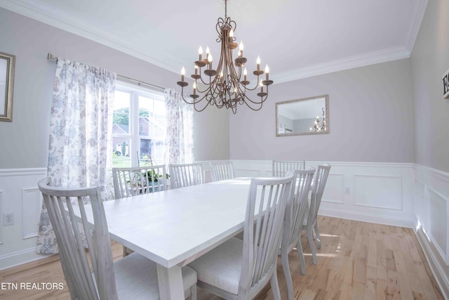 160 Brentwood Pl, Lenoir City, TN 37772 - dining space featuring a chandelier, wainscoting, crown molding, a decorative wall, and light wood-style floors