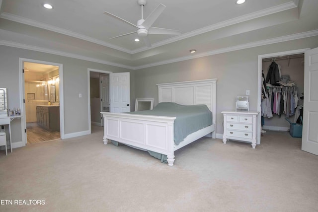 160 Brentwood Pl, Lenoir City, TN 37772 - bedroom featuring light carpet, a walk in closet, baseboards, a tray ceiling, and ornamental molding