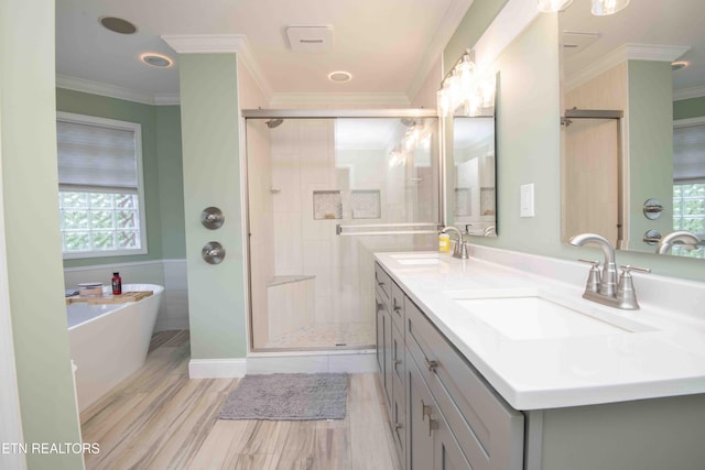 160 Brentwood Pl, Lenoir City, TN 37772 - bathroom with crown molding, a soaking tub, a shower stall, double vanity, and wood finished floors