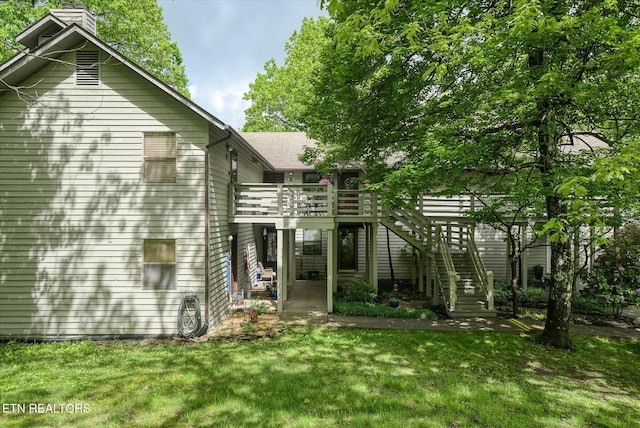 281 Moytoy Rd Unit 204, Crab Orchard, TN 37723 - back of property featuring a chimney, stairs, a wooden deck, and a yard