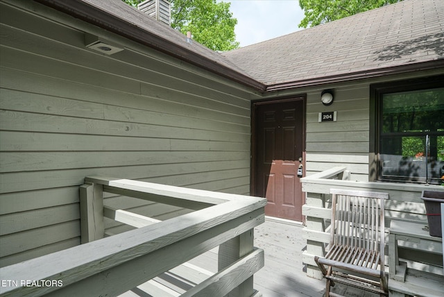 281 Moytoy Rd Unit 204, Crab Orchard, TN 37723 - view of exterior entry with a chimney and a shingled roof