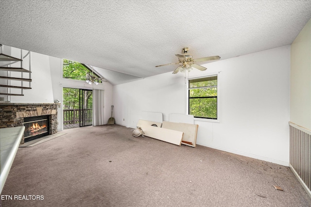 281 Moytoy Rd Unit 204, Crab Orchard, TN 37723 - unfurnished living room featuring carpet flooring, plenty of natural light, a textured ceiling, ceiling fan, and vaulted ceiling