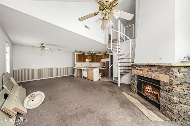 281 Moytoy Rd Unit 204, Crab Orchard, TN 37723 - unfurnished living room featuring a ceiling fan, carpet flooring, stairway, and a fireplace