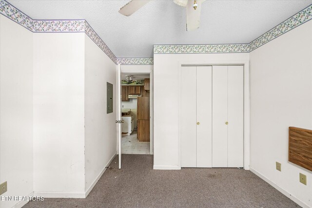 281 Moytoy Rd Unit 204, Crab Orchard, TN 37723 - unfurnished bedroom with electric panel, carpet floors, a closet, a textured ceiling, and baseboards