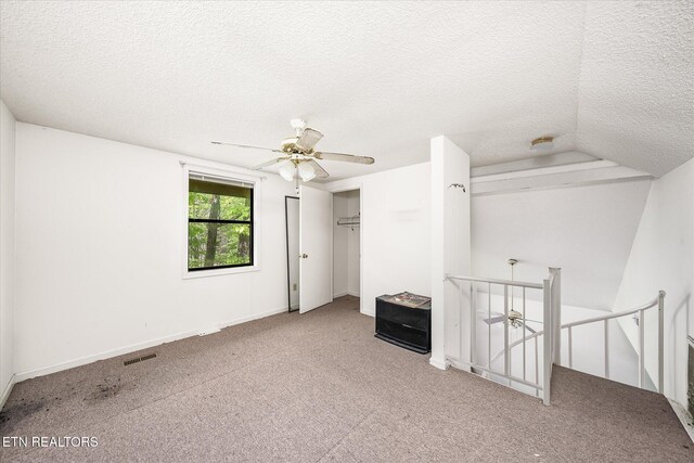 281 Moytoy Rd Unit 204, Crab Orchard, TN 37723 - unfurnished bedroom with a textured ceiling, carpet flooring, a ceiling fan, and a closet